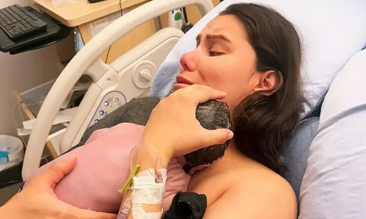 Mother sleeps through birth, wakes to find son born under blanket