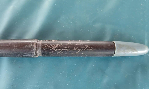 Engraved pen found buried with fallen soldier's remains in Hue