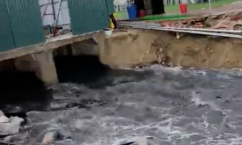 Black wastewater flows onto Sam Son beach