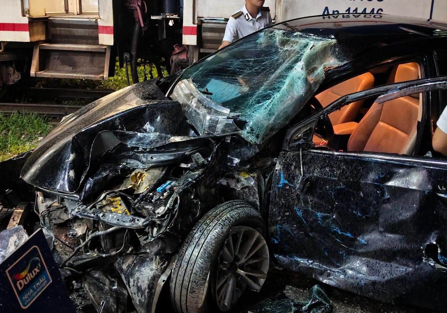 4-seater car mangled after train collision in Hanoi