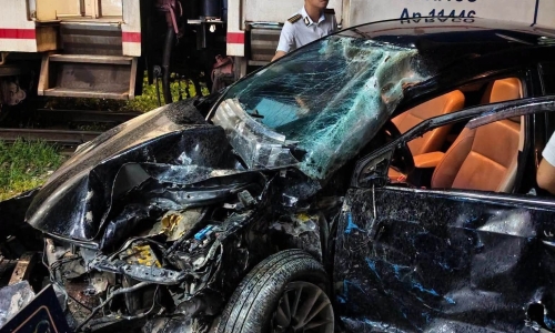4-seater car mangled after train collision in Hanoi