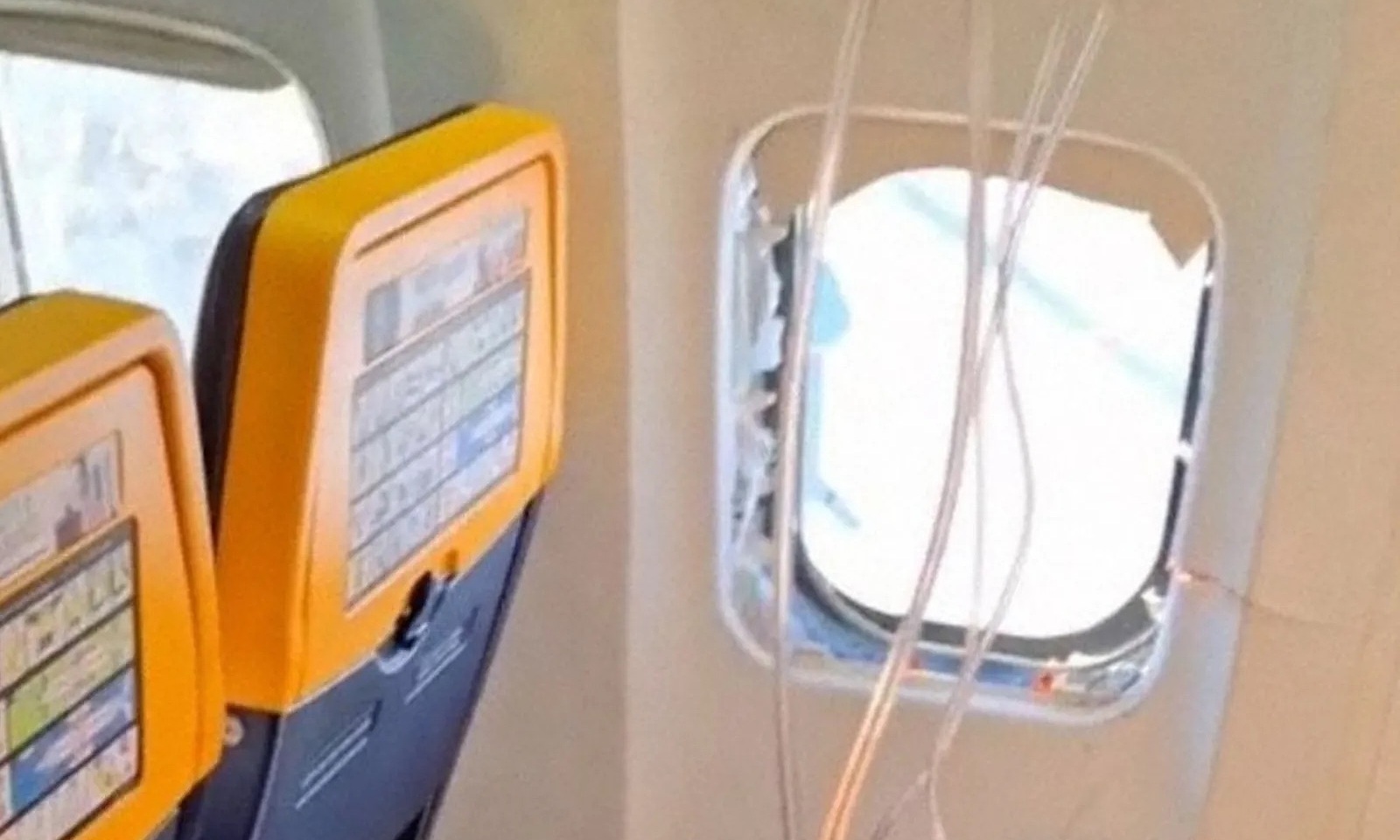 Airplane window blows out mid-air, passenger nearly sucked out