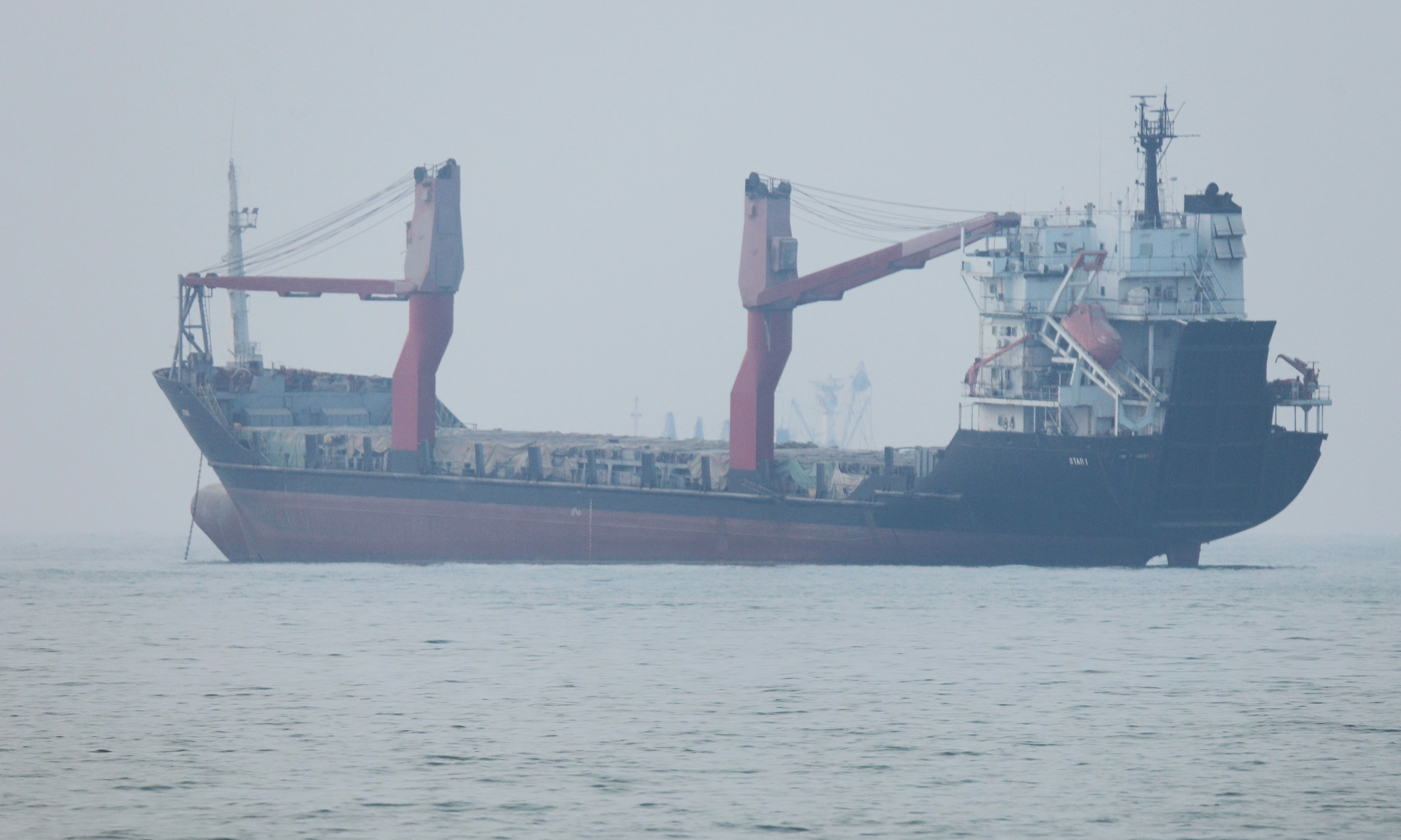 Iran fires 'warning shots' at two ships in Hormuz
