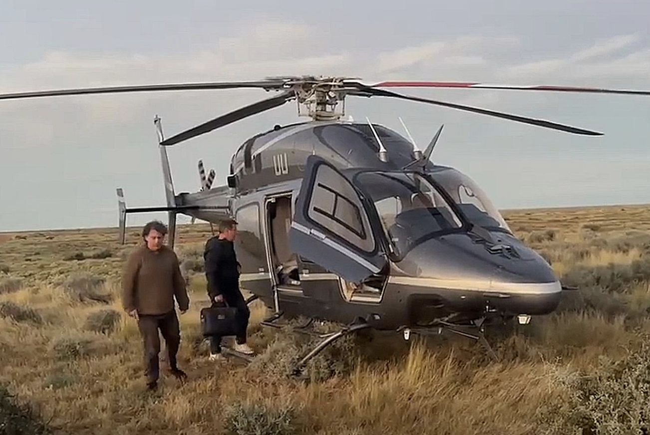 Billionaire rescues two stranded in floods with private helicopter