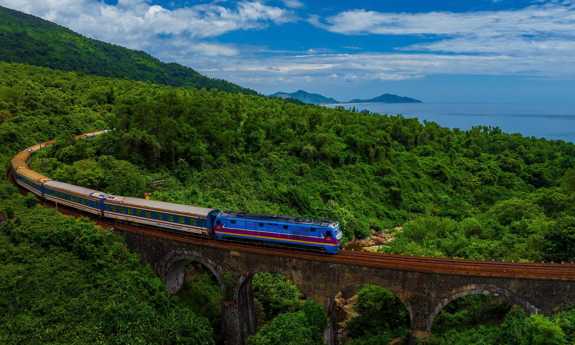 train through mountains on vietnam's most beautiful route