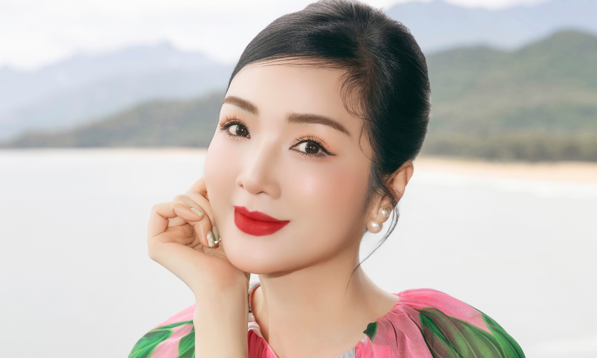 Giang My transforms with multi-colored patterned dresses