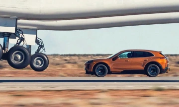 Porsche electric car pursues massive aircraft during takeoff