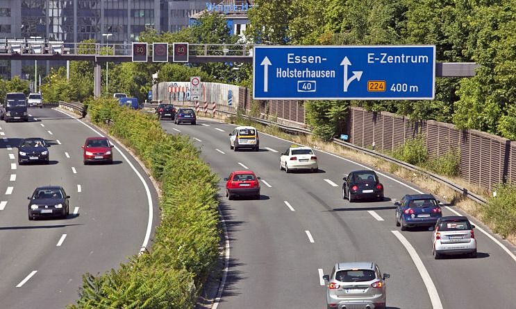 What constitutes 'continuous driving' in the left highway lane?