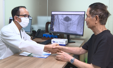Combining embolization beads and biological glue to treat benign prostatic hyperplasia