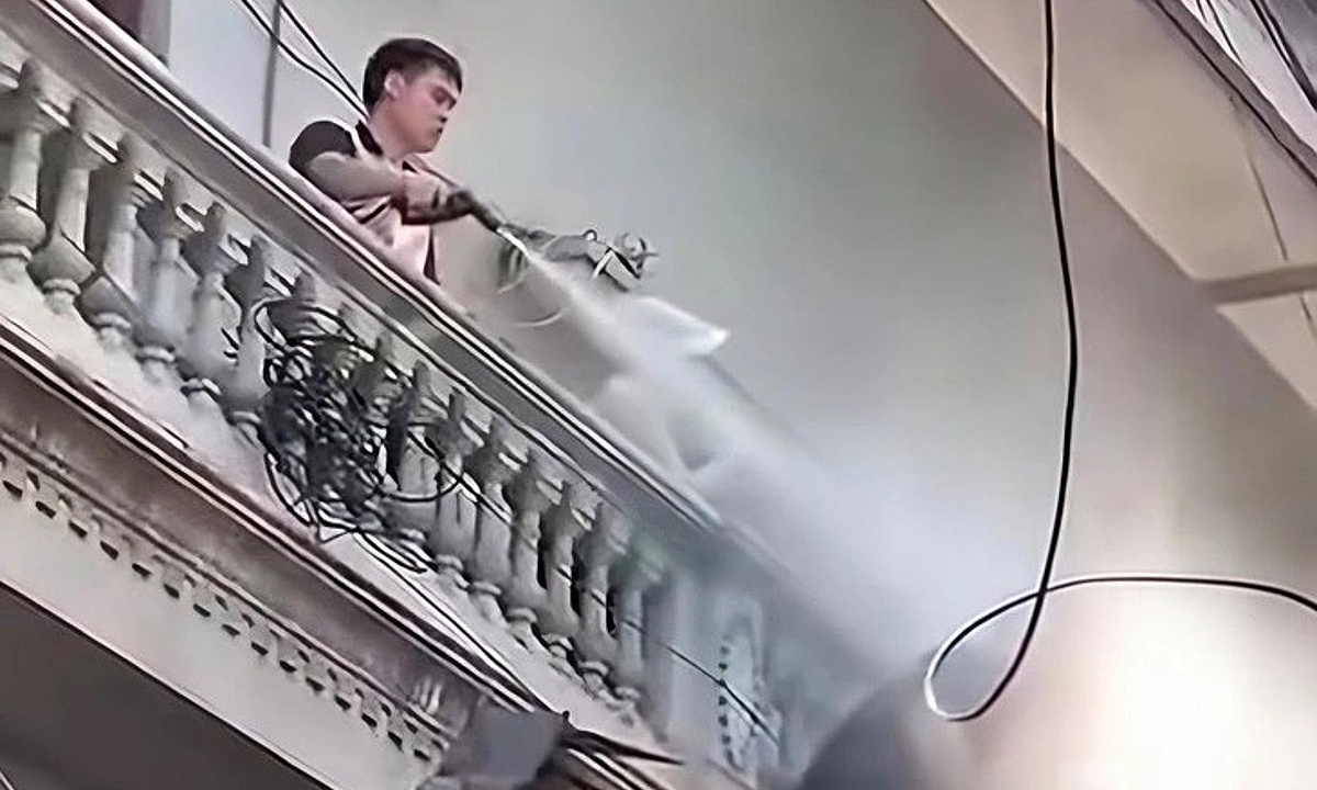 Man charged after spraying water on workers demolishing adjacent house