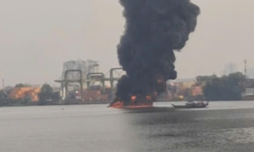 Barge fire on Saigon river leaves one dead