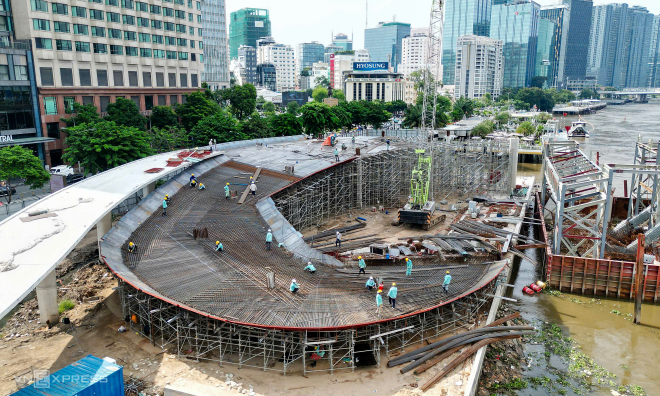 Nipa palm leaf-shaped pedestrian bridge over Saigon River nears completion