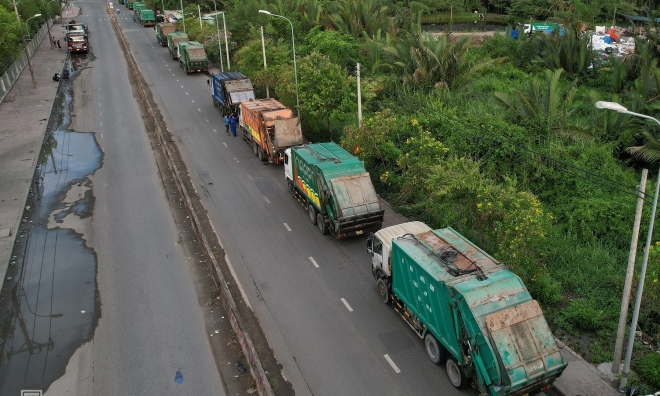 Where do 14,000 tons of daily waste in Ho Chi Minh City go?