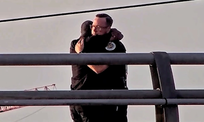 Forty-five minutes: US police officer helps man step back from the brink on Nashville bridge