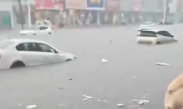 Cars swept away in flooded streets across China