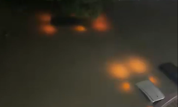 Cars submerged in floodwaters, occupants die