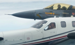 Thai prime minister flies his own plane to military base
