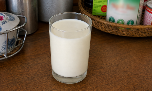 Should children stop drinking milk if early puberty is suspected?