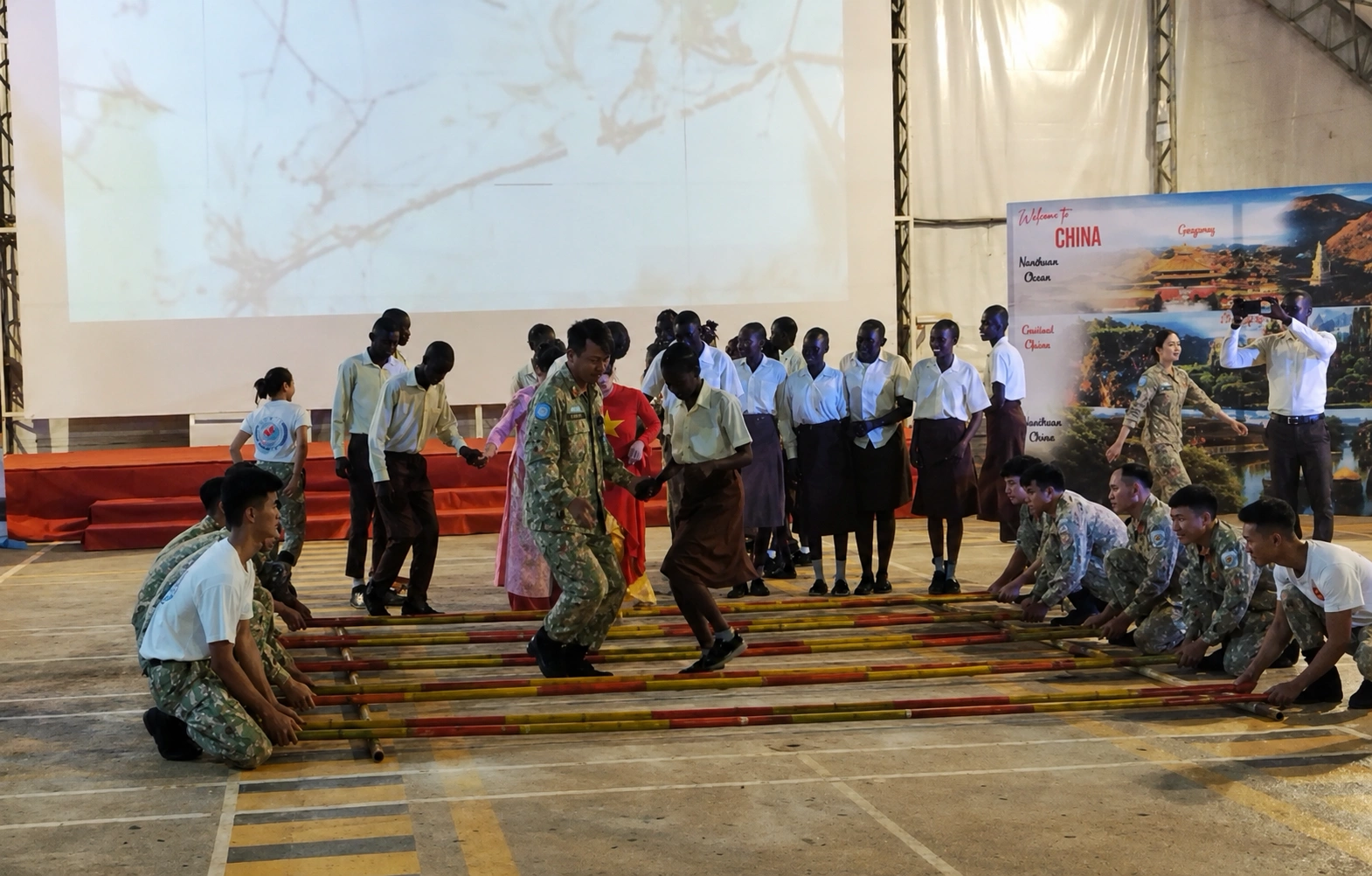 Vietnamese soldiers and African students share traditional bamboo dance