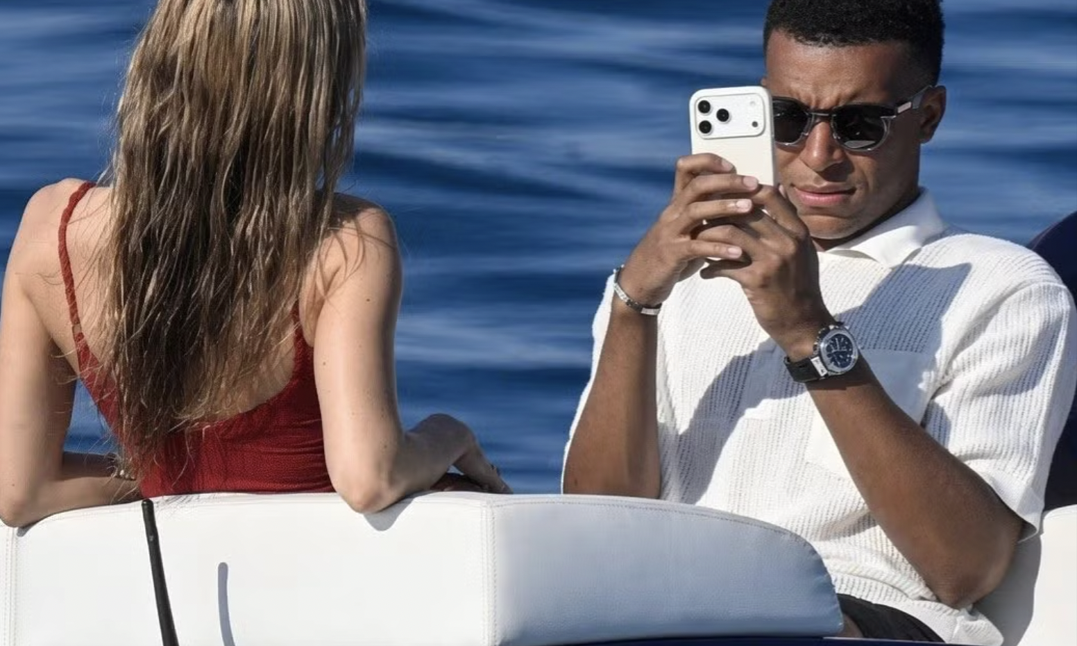 Why do men often take unflattering photos of their partners?