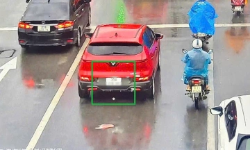 Evading traffic camera fines by attaching two license plates