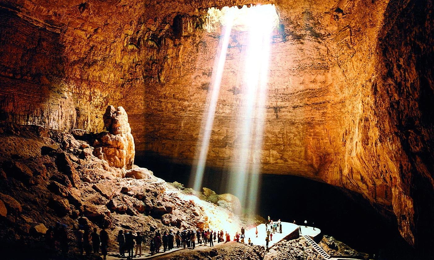 Sliding through a 3-million-year-old cave in China