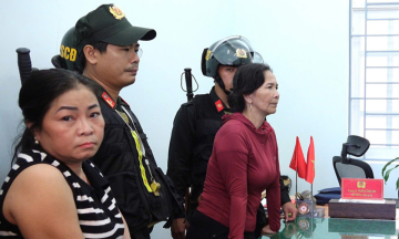 Two women accused of inciting public to obstruct sand mining