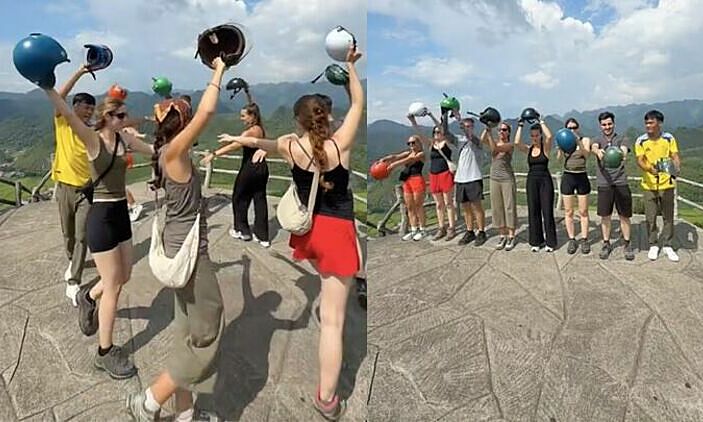 Western tourists dance to "Vietnam, My Homeland" with helmets