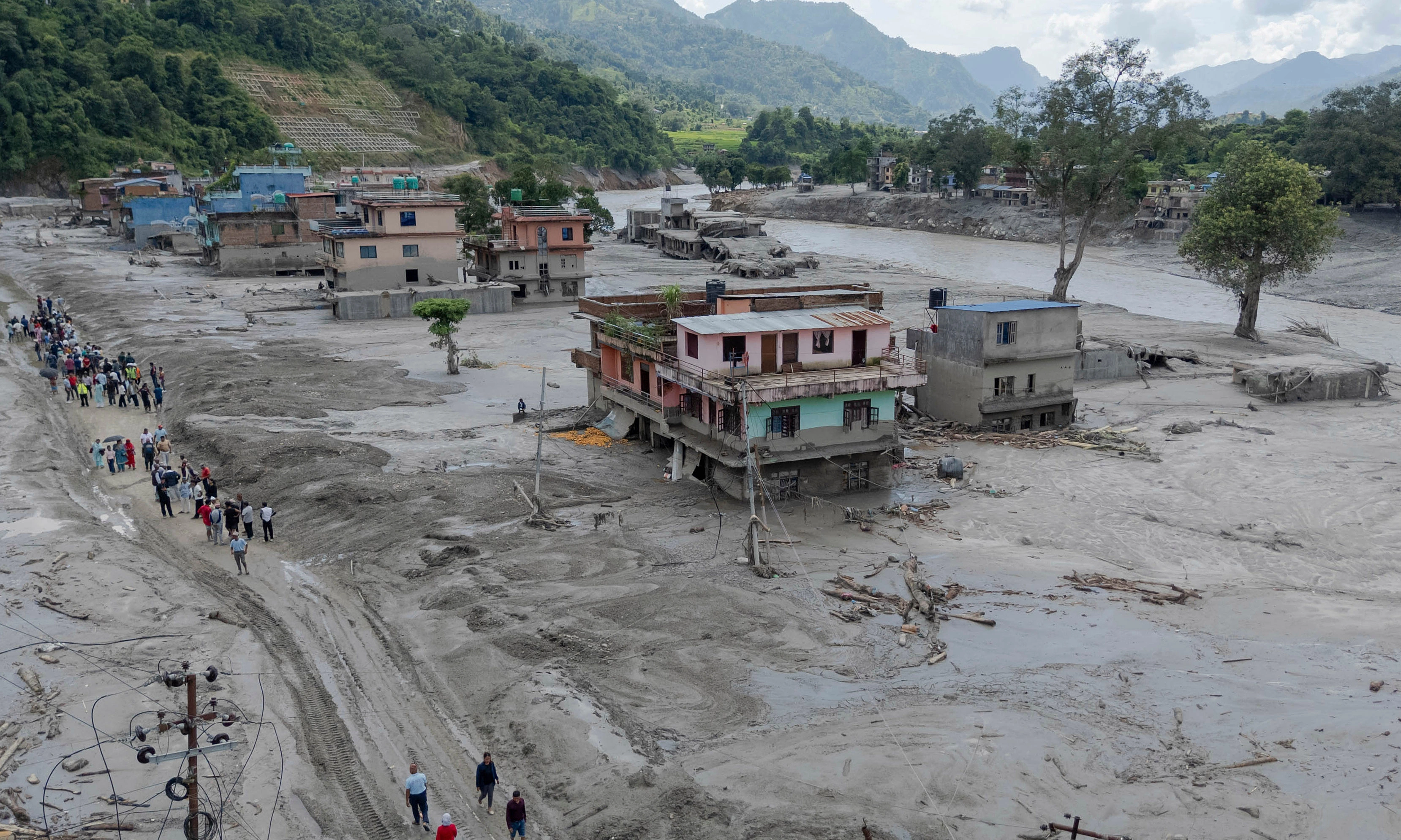 Landslide-dammed lake overflows, Nepal evacuates rescue personnel