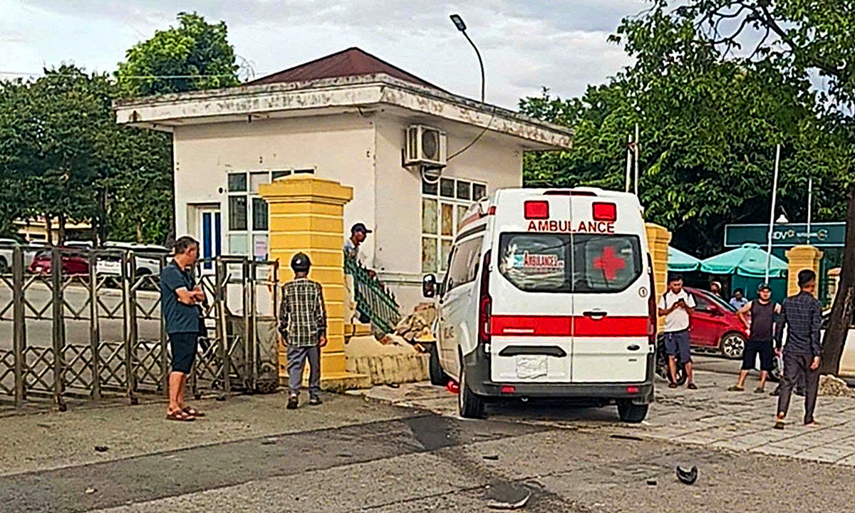 Ambulance crashes into hospital fence