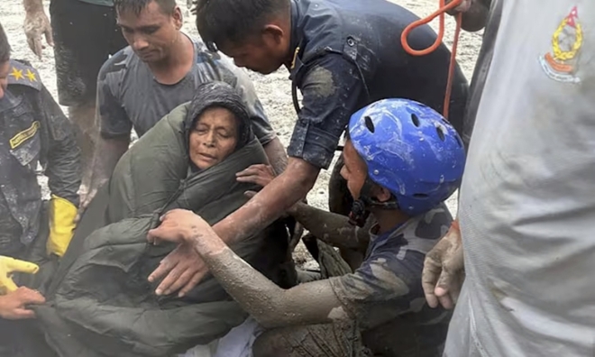Woman survives 10 days buried after Nepal flash flood
