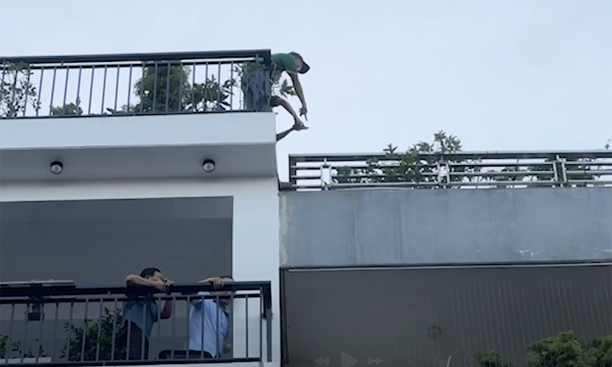 Residents carry children, climb balconies to escape 6-story house fire