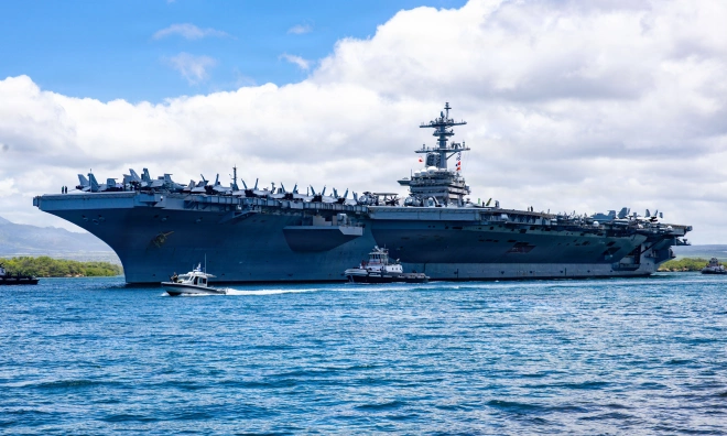 US aircraft carrier utilizes every available space for supplies before heading to the Middle East