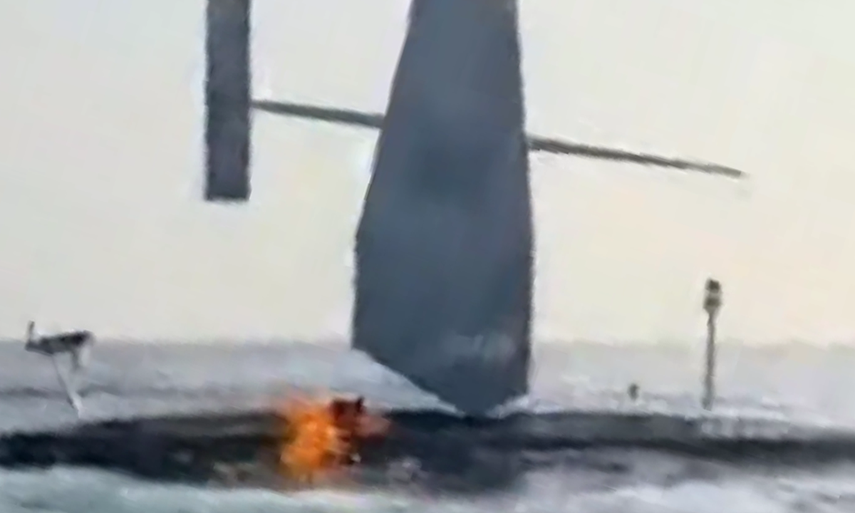 US unmanned vessel burns 'after Iranian strike'