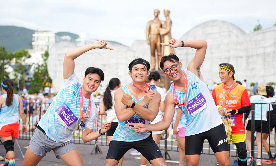 Runners celebrate and recover after the VM Quy Nhon finish line