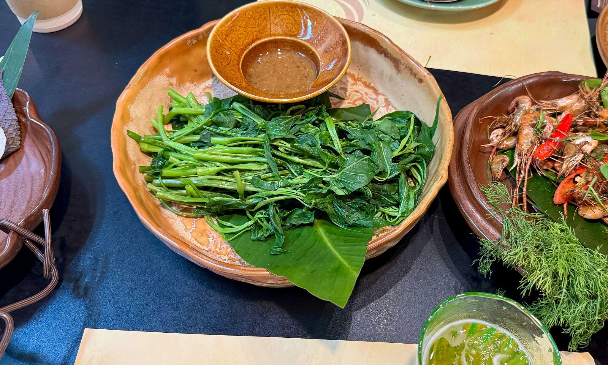 Who should limit water spinach consumption?