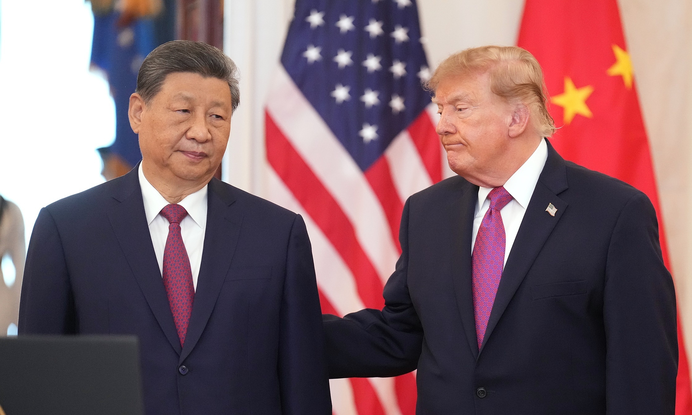 The message behind the handshakes between Trump and Xi