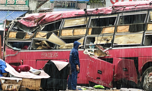 Driver detained in bus rollover with two deaths