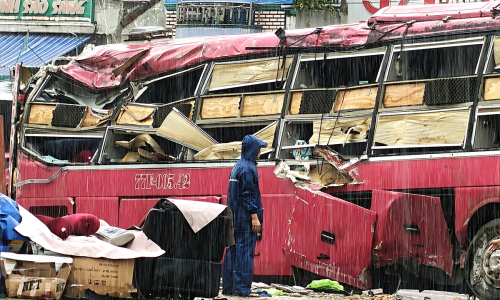 Driver detained in bus rollover with two deaths