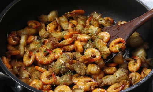 Seasoning during cooking or waiting until food is done to reduce salt?
