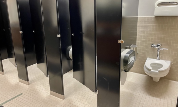 Why public restroom stalls in the US always have gaps